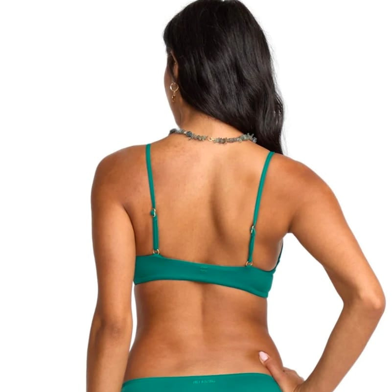 Green bikini set on a model against a white background