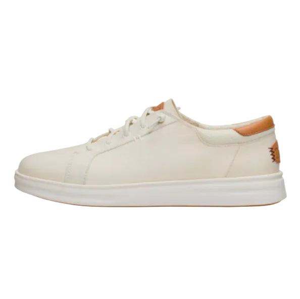 White sneaker with brown accents on a white background