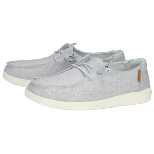 Pair of light gray sneakers with white soles on a white background