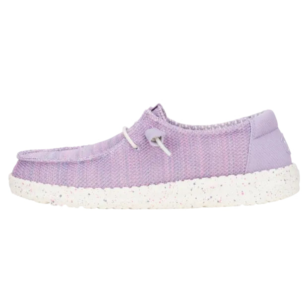 Purple slip-on shoe with white sole on a white background