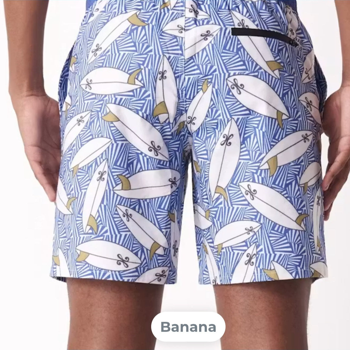 Blue shorts with white surfboard pattern worn by a person
