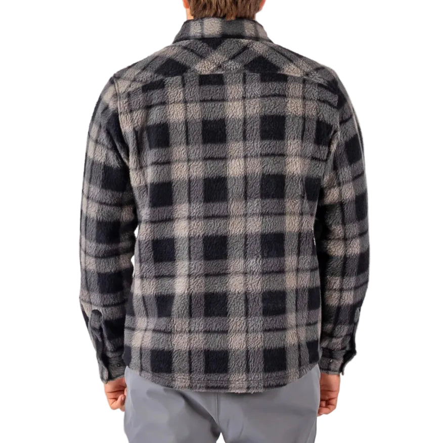Person wearing a black and gray plaid shirt on a white background
