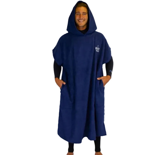 Person wearing a blue poncho with a brand logo on a white background