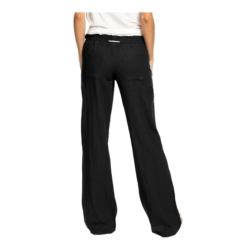 Black wide-leg pants worn by a person on a white background