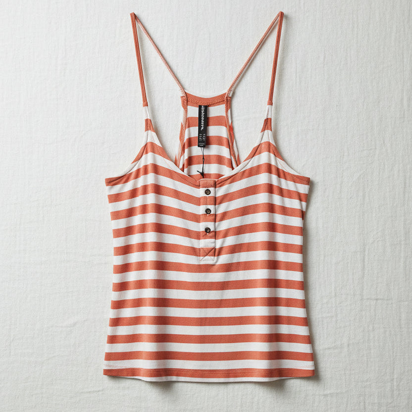 Striped tank top with buttons on a woven surface