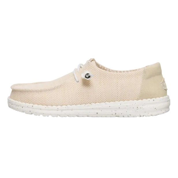 Beige slip-on shoe with white sole on a white background