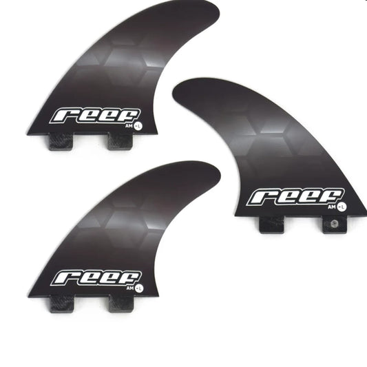 Three black surfboard fins with 'reef' branding on a white background