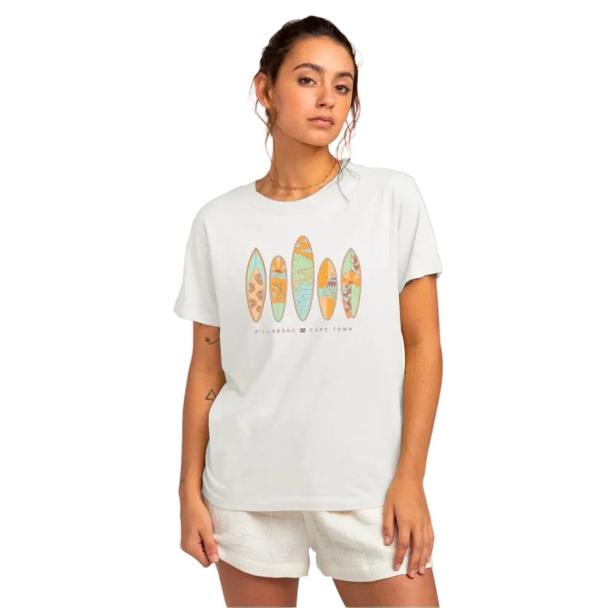 Woman wearing a white t-shirt with surfboard graphic design on a white background