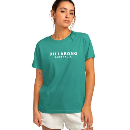 Woman wearing a teal Billabong Australia t-shirt with a white logo