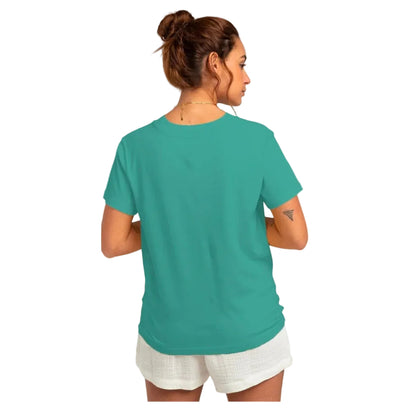 Woman wearing a teal t-shirt and white shorts on a white background