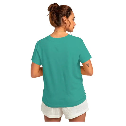 Woman wearing a teal t-shirt and white shorts on a white background