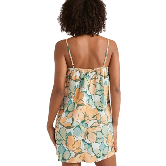 Woman wearing a floral dress with a white background
