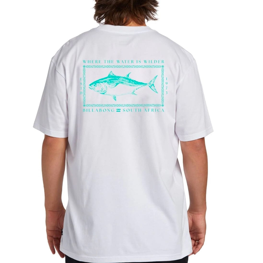 Person wearing a white t-shirt with a blue graphic design on the back, featuring text and a fish illustration.