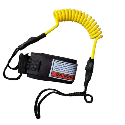 Yellow coiled leash with a black clip on a gray fabric background