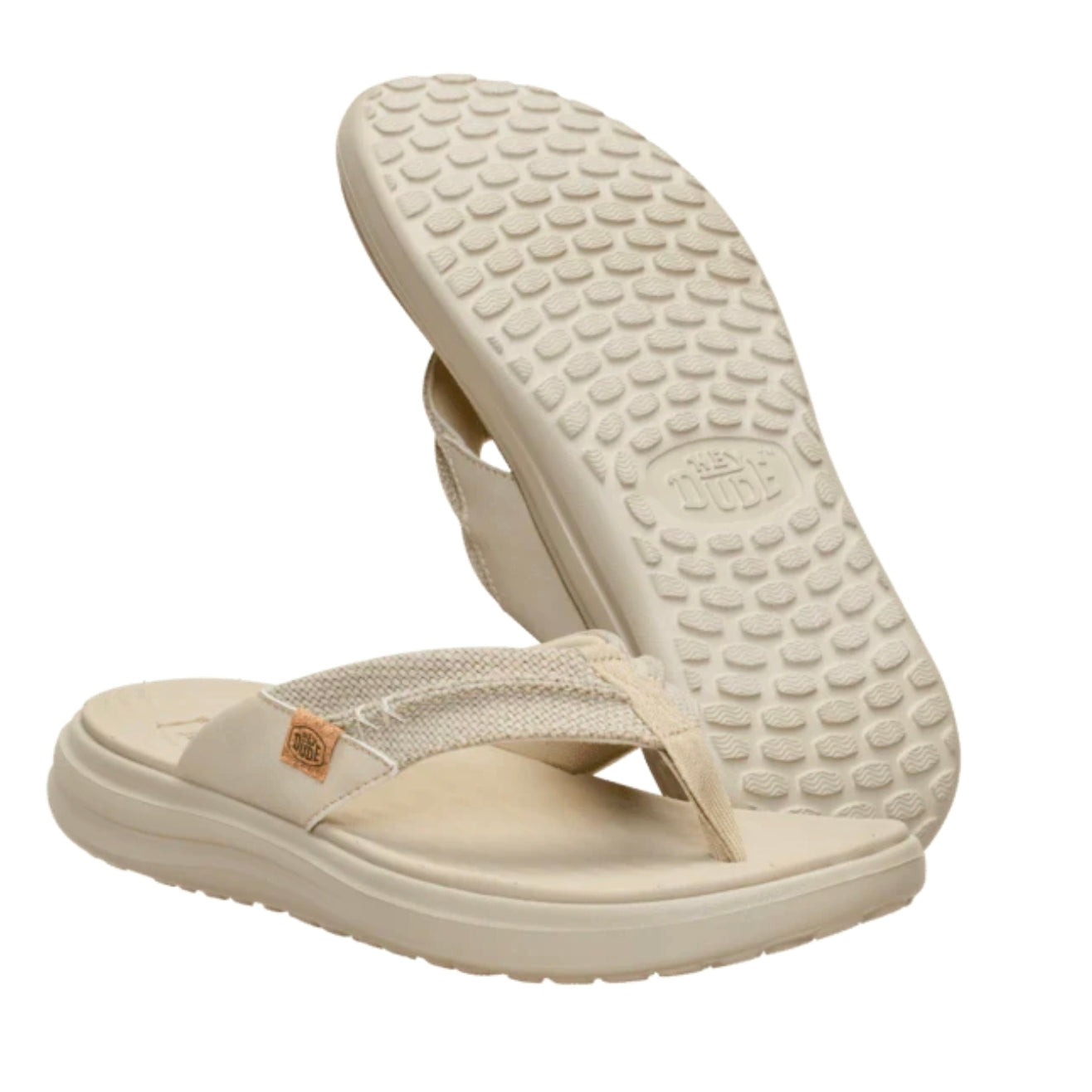 Beige flip-flops with textured sole on a white background