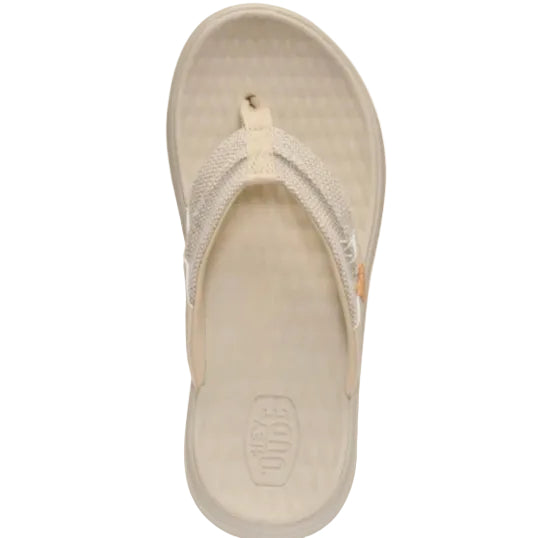 Beige sandal with a brand logo on a white background