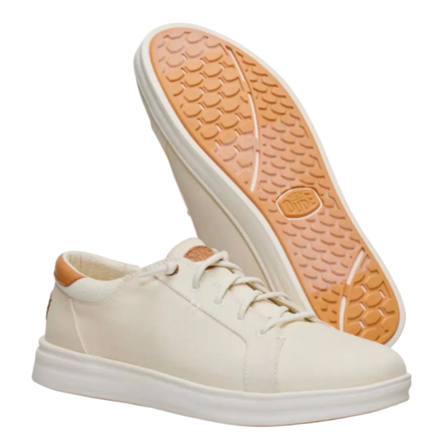 White sneakers with tan soles on a white background
