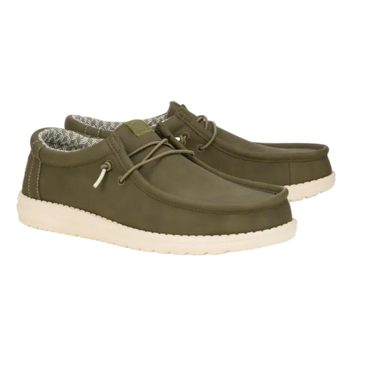 Pair of green casual shoes with white soles on a white background