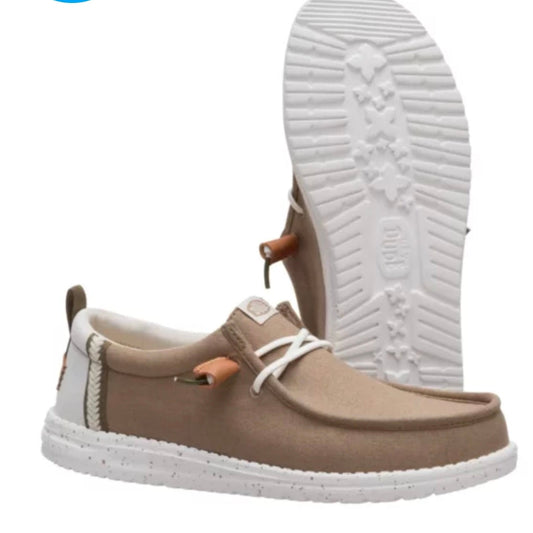 Brown casual shoe with white sole on a white background