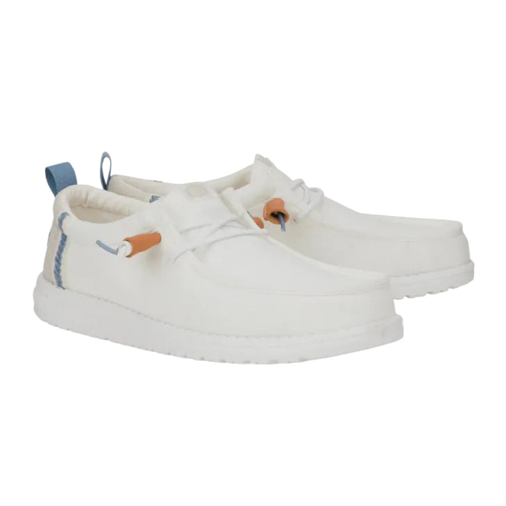 White sneakers with decorative elements on a white background