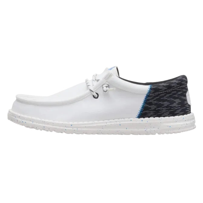White shoe with black and blue patterned heel on a white background