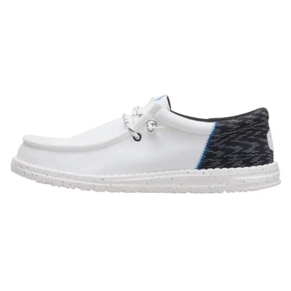 White shoe with black and blue patterned heel on a white background