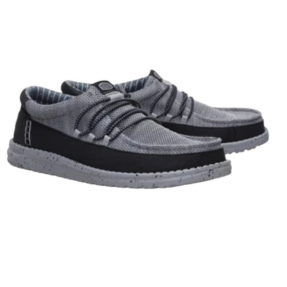 Pair of gray and black shoes on a white background