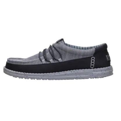 Gray and black slip-on shoe on a white background