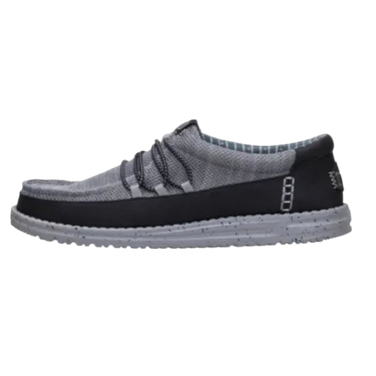 Gray and black slip-on shoe on a white background