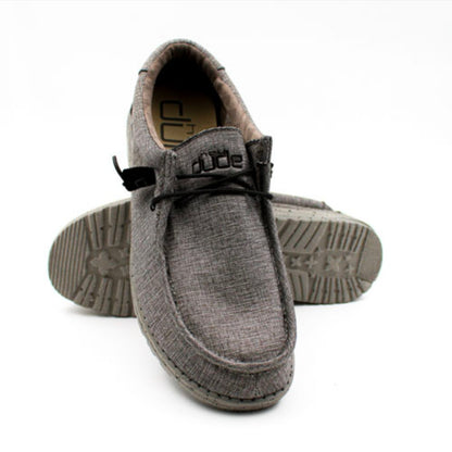 Gray slip-on shoes with 'dude' branding on a white background