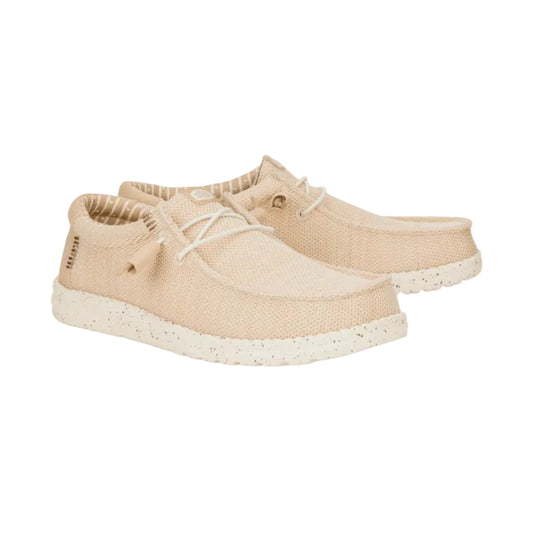 Beige sneakers with white soles on a white background