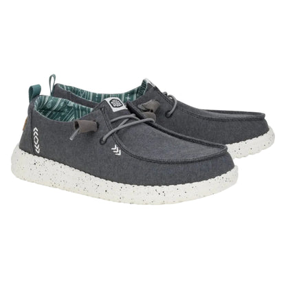 Pair of gray casual shoes with white soles on a white background