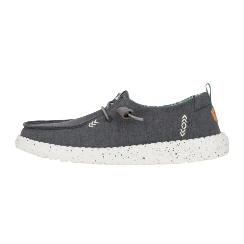 Gray shoe with white sole on a light gray background