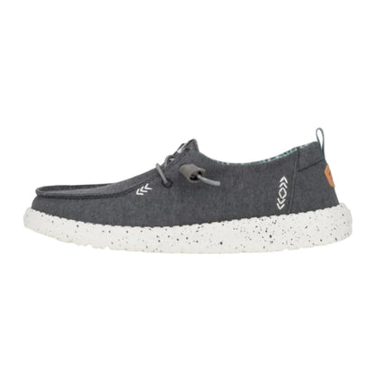 Gray shoe with white sole on a light gray background