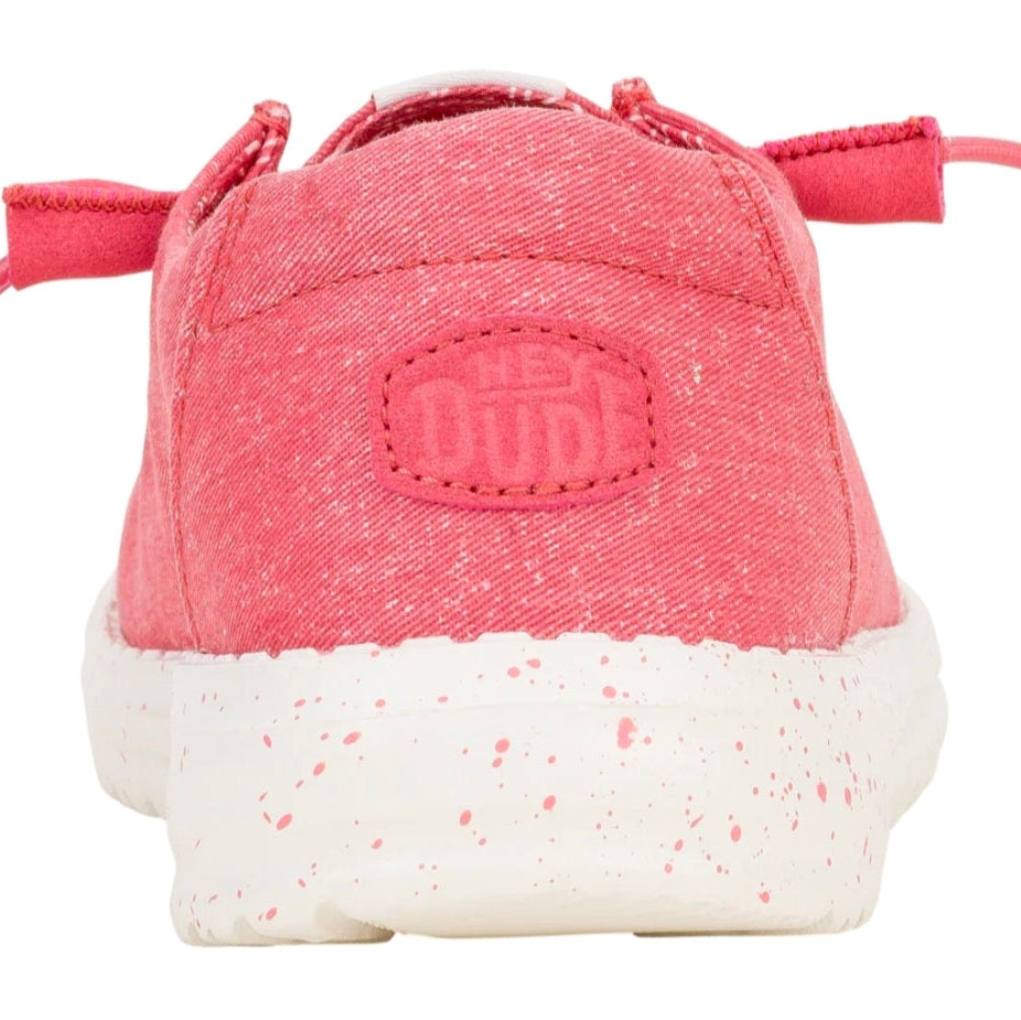 Pink children's shoe with white sole on a white background