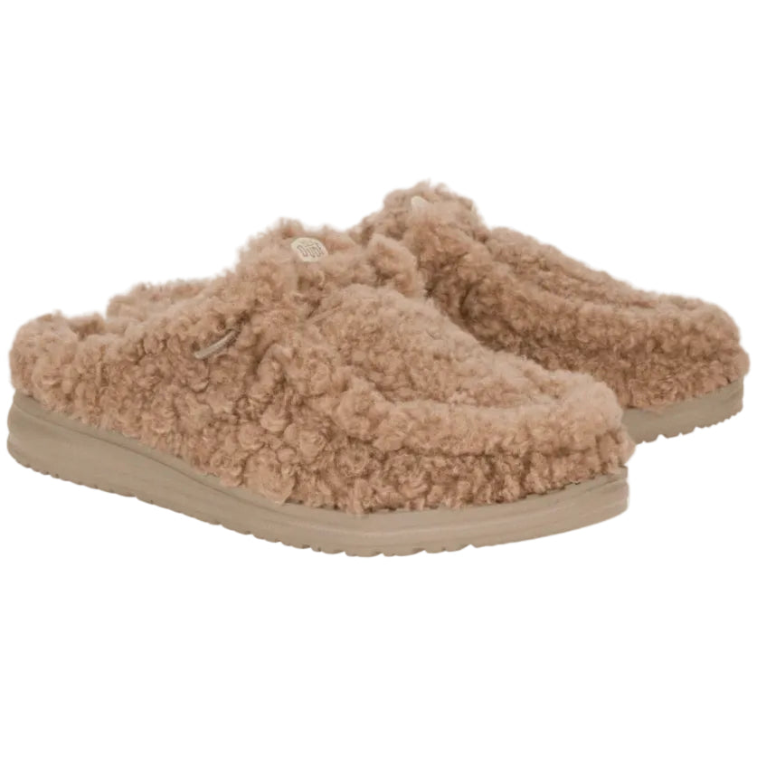 Pair of beige fuzzy slippers on a white background