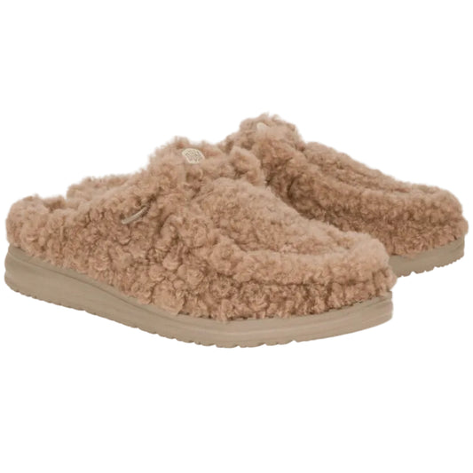 Pair of beige fuzzy slippers on a white background