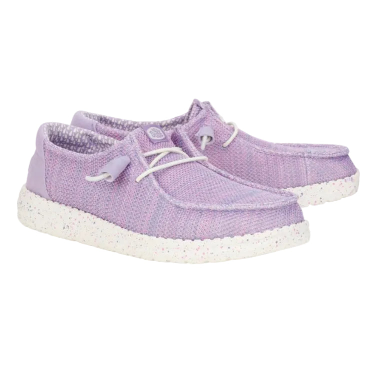Pair of purple sneakers with white soles on a white background