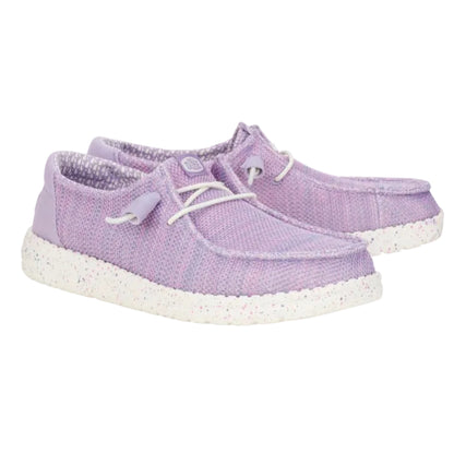 Pair of purple sneakers with white soles on a white background