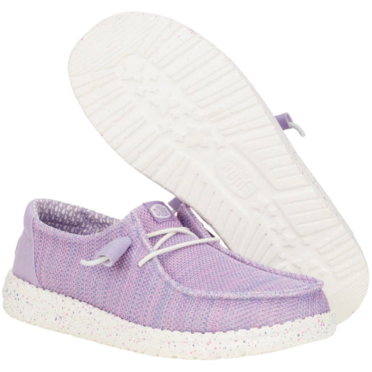 Purple shoe with white sole on a white background
