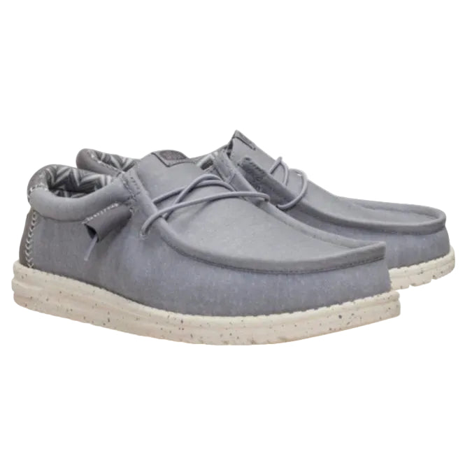 Pair of gray loafers on a white background