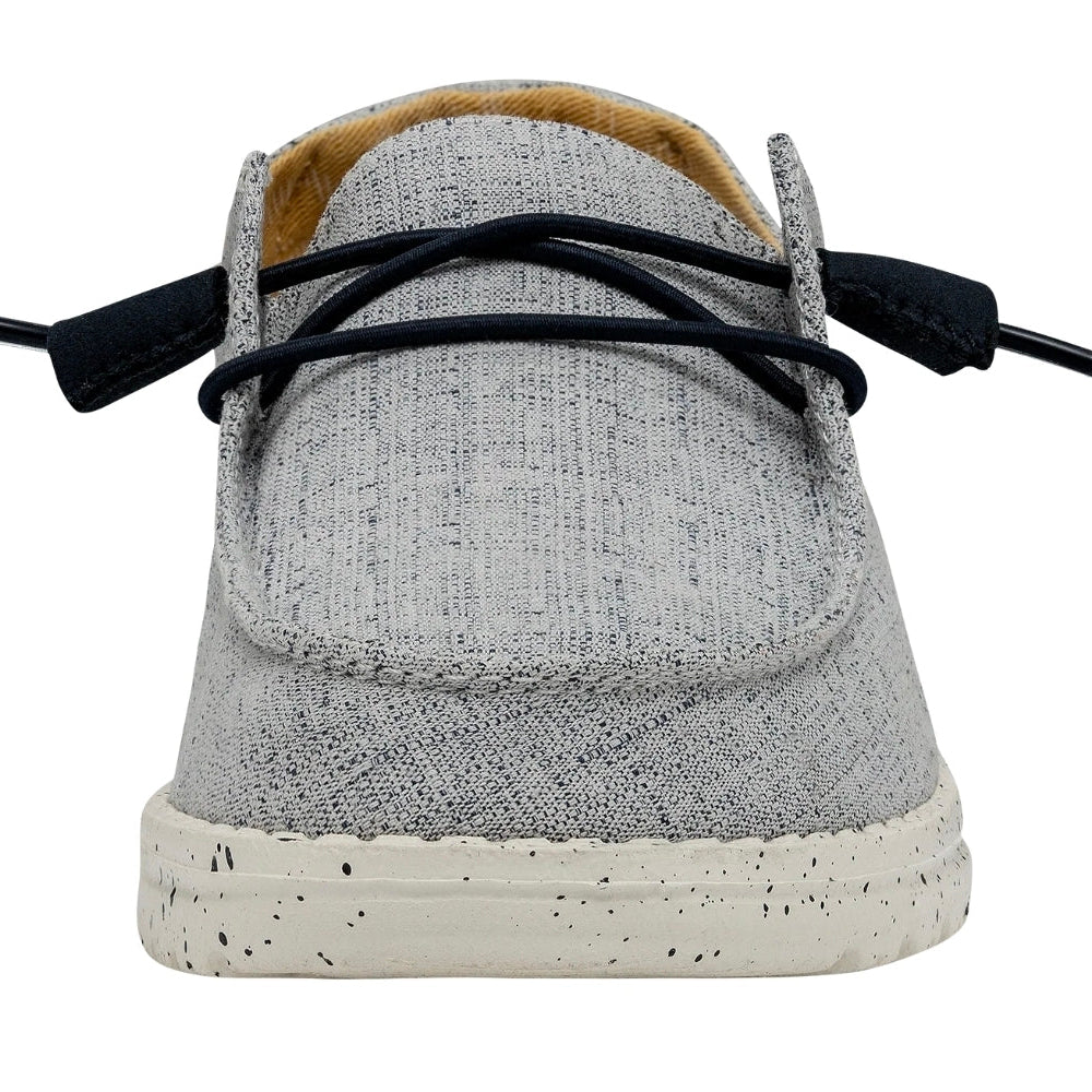 Gray shoe with white sole on a white background