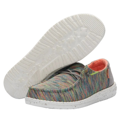Multicolored plaid shoe with white sole on a white background