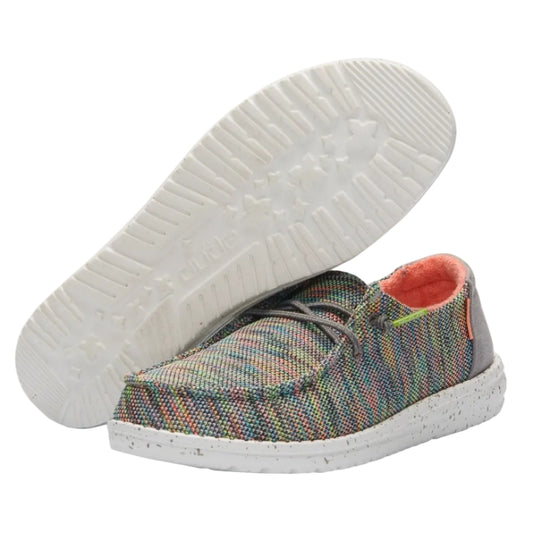 Multicolored plaid shoe with white sole on a white background