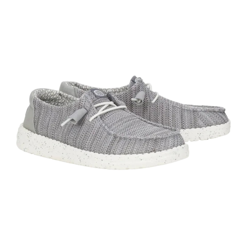 Gray sneakers with white soles on a white background