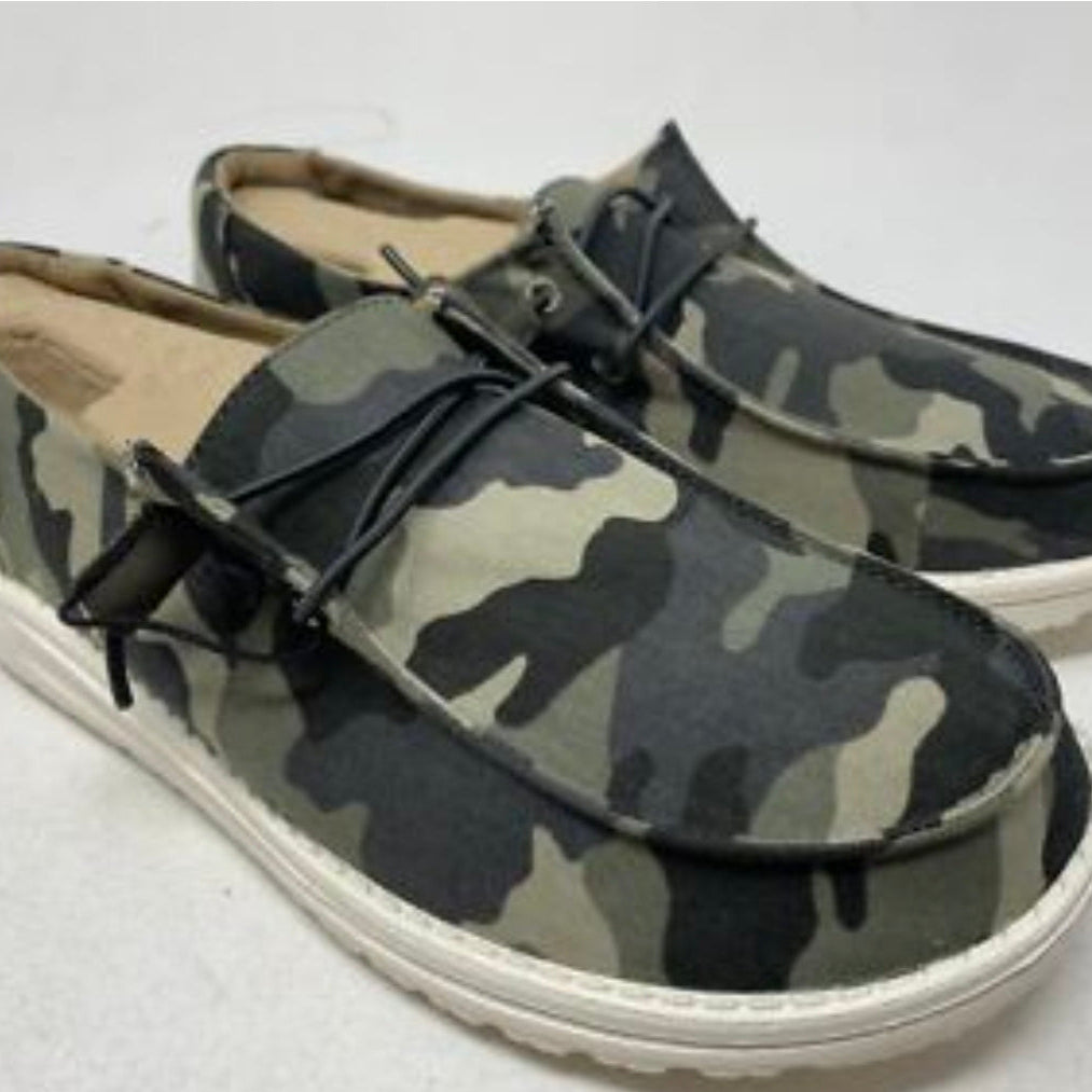 Camouflage-patterned shoes with white soles on a light gray background