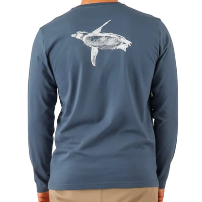 Blue long-sleeve shirt with a turtle design on the back, worn by a person.