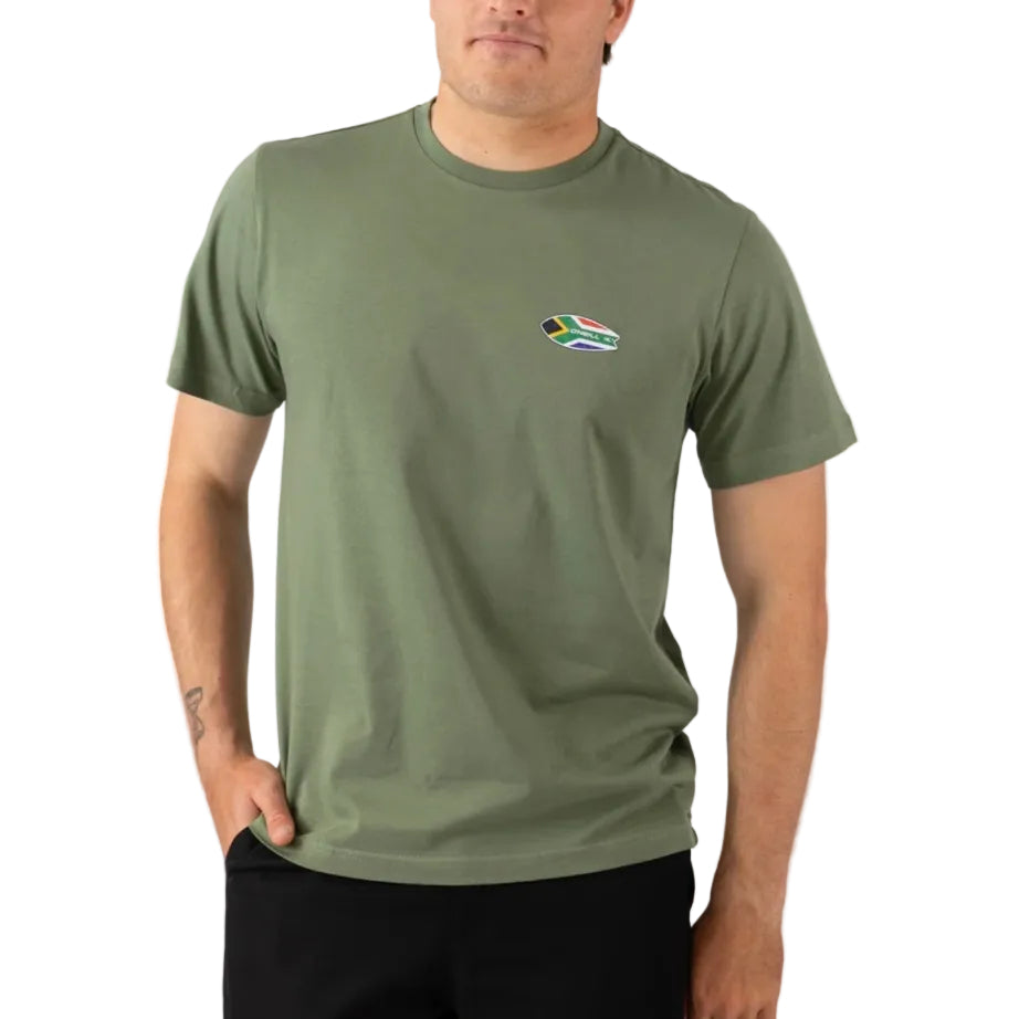Person wearing a green t-shirt with a small flag logo on a white background