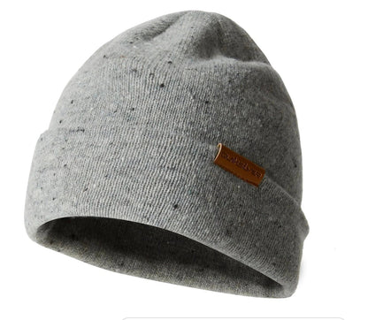 Gray beanie with a brown label on a white background