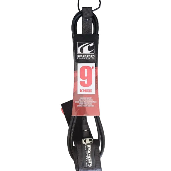 Black surfboard leash with a red label on a gray surface